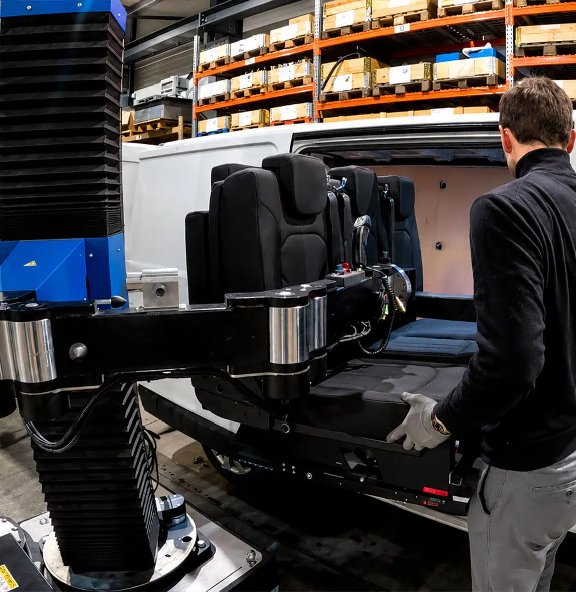 Neoditech SCARA TITAN manipulator arm inserting a rear seat into a converted vehicle – Automotive industry