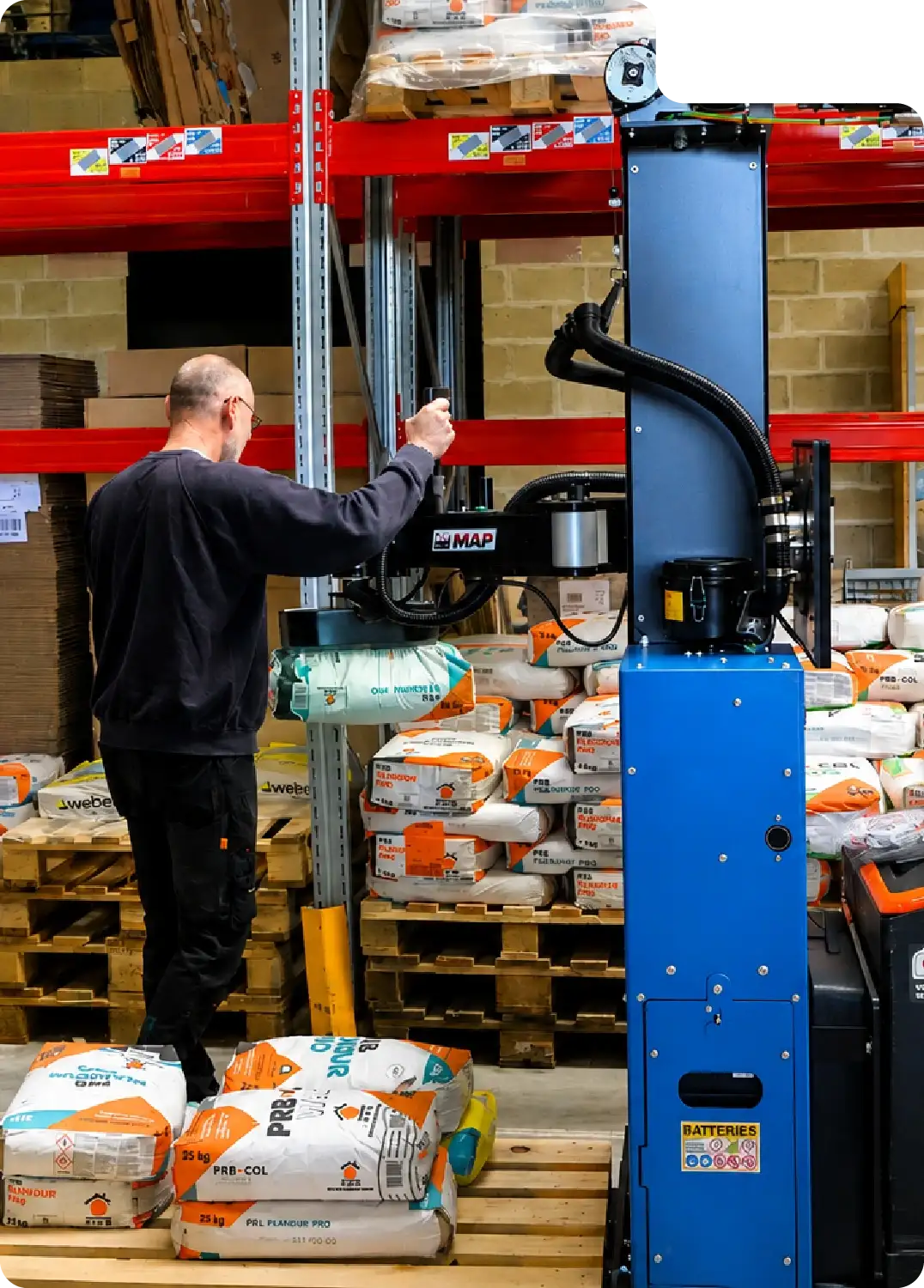 Gripping glue bags using the Neoditech Mobile Order Picker for logistics and warehouse ergonomic handling